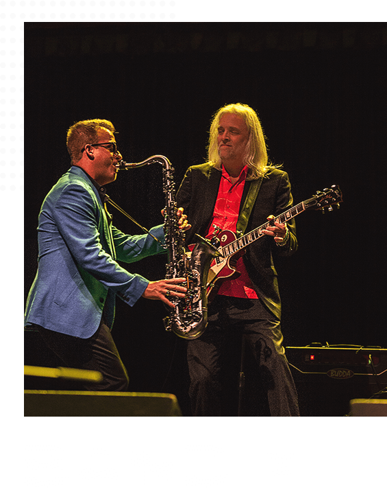 Guitarist with an electric guitar and a saxophonist with a saxophone